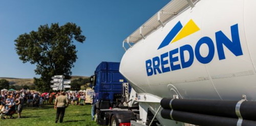 This image: a photograph of a Breedon cement lorry at a community event. 
							 The map: the map shows the blue boundary of Breedon's ownership area at the site, with 
							 coloured land parcels and map markers representing the wide array of tenants Breedon 
							 have around the site.